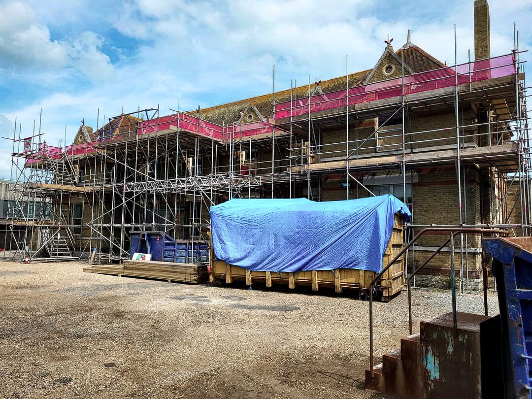 Large Victorian commercial building with full scaffolding during major refurbishment, Isle of Wight