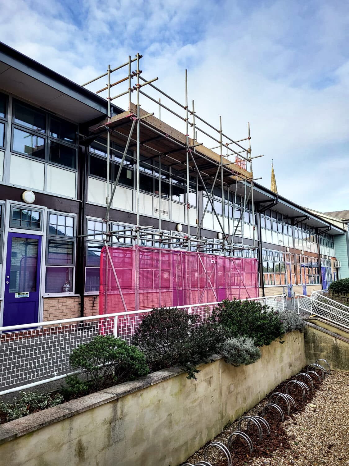 Scaffolding erected on a school building for roof works on the Isle of Wight