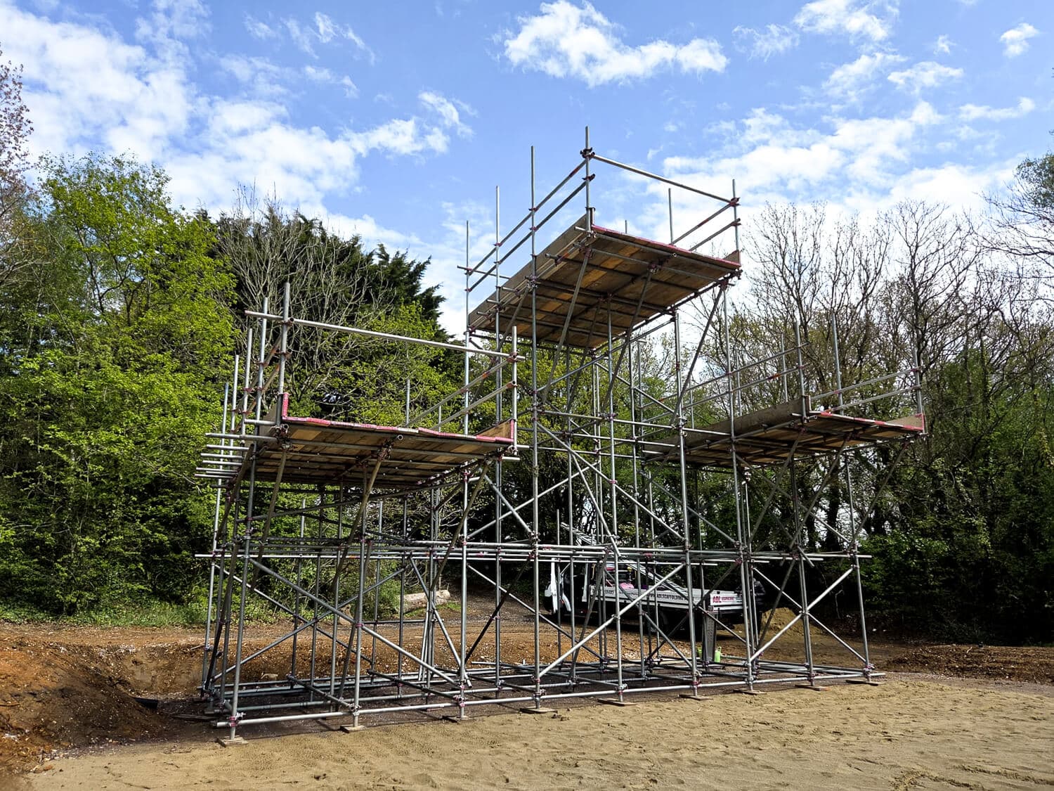 Free-standing bespoke scaffolding structure erected in open ground, Isle of Wight