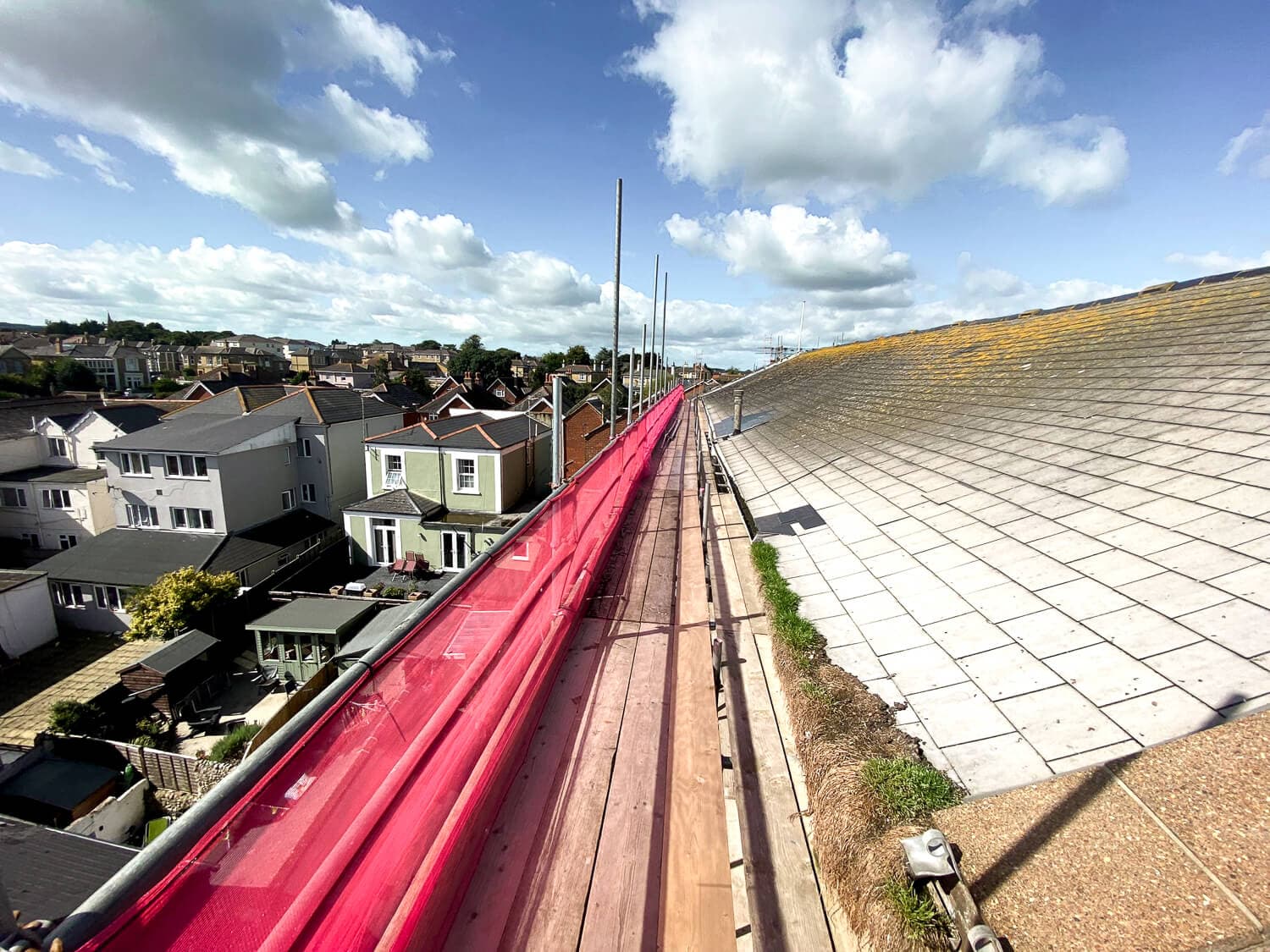 View from the top of a large commercial roof with ADL Scaffolding safety netting, Isle of Wight